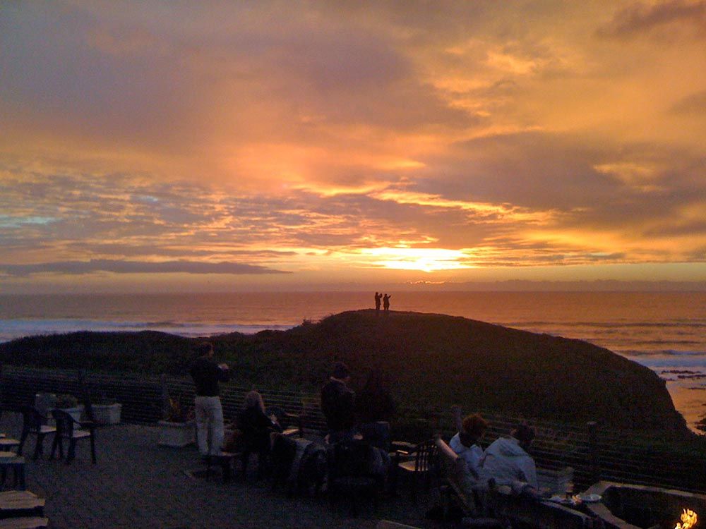 dramatic sunset over the ocean at Moss Beach Distillery patio